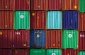 Bright stack of steel cargo containers at busy harbor Royalty Free Stock Photo